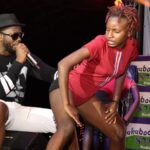 VIDEO: Bebe Cool chews female fan on stage