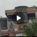 VIDEO: Shock! Man in Mbarara climbs on electric wires alongside streets