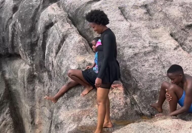 VIDEO: Barbie looks stunning in a swimming costume on family day out