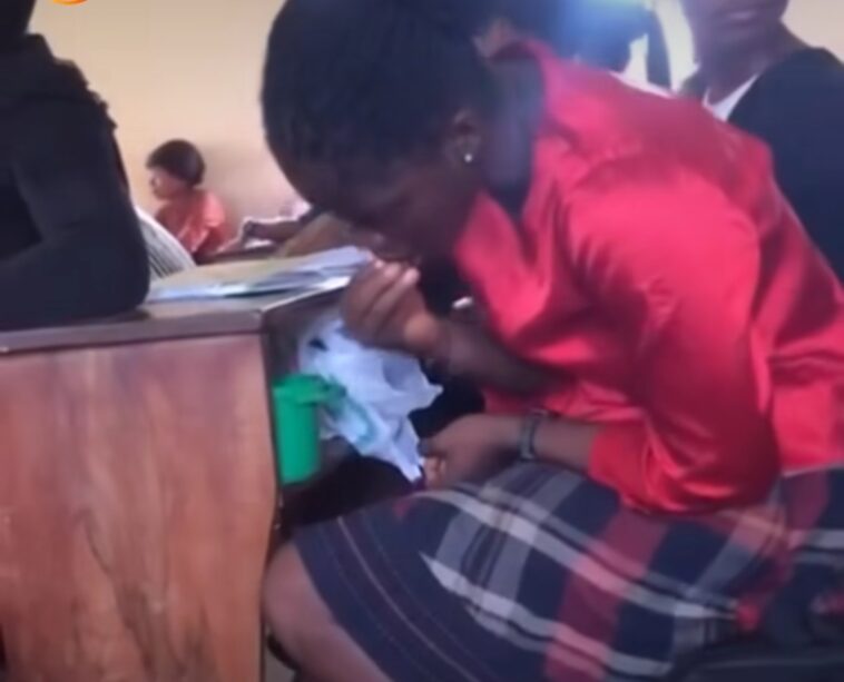 Video: University female student filmed eating a bucket of food in class