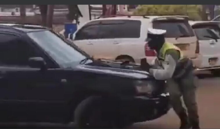 VIDEO: Watch angry Ugandan knock down a traffic officer trying to stop him